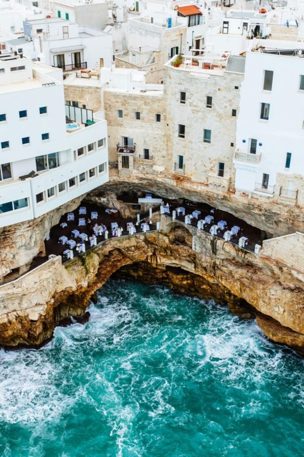 Stunning cliffside hotel in Polignano a Mare, overlooking the vibrant Adriatic Sea.